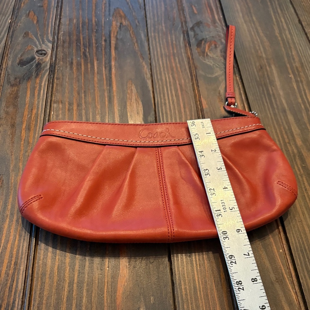 Coach orange clutch/wristlet
